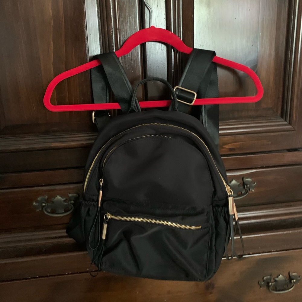 Black and gold mini backpack